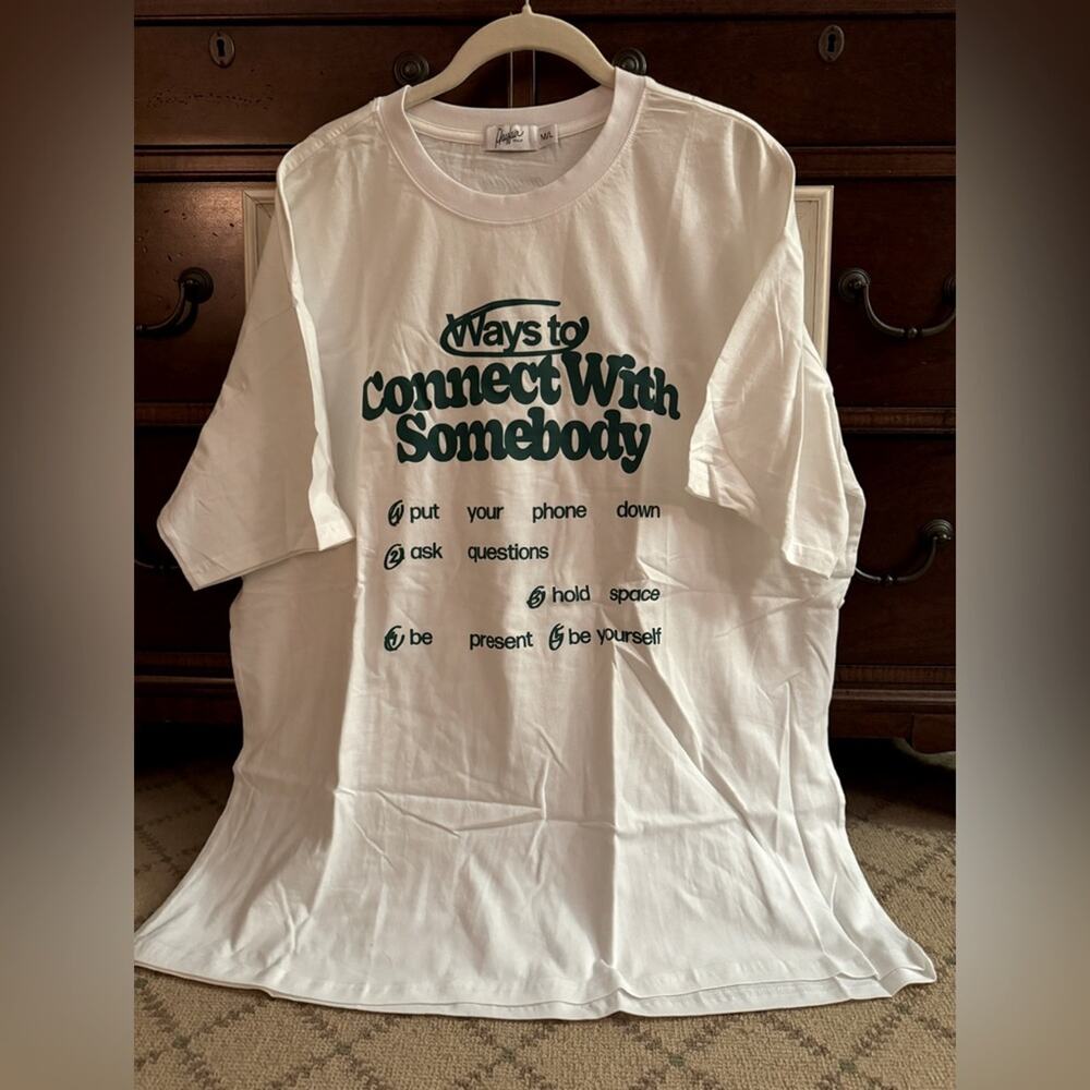 Mayfair white short sleeve T-shirt with green text on the front. M/L NWOT